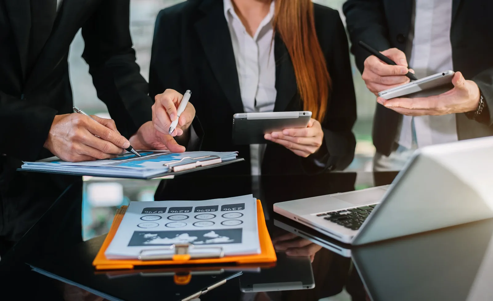Tax advisors reviewing reports